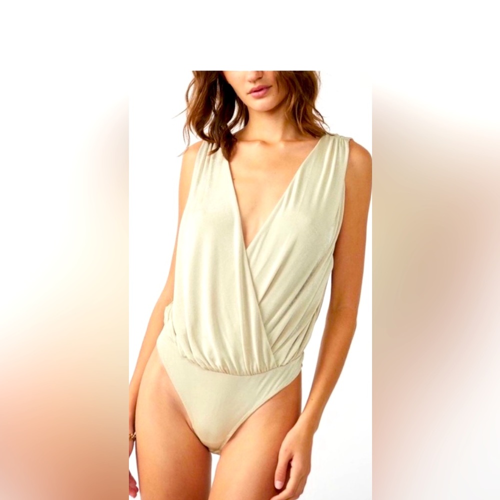 NWT Free People Night owl bodysuit in a nude , beige , oat color.